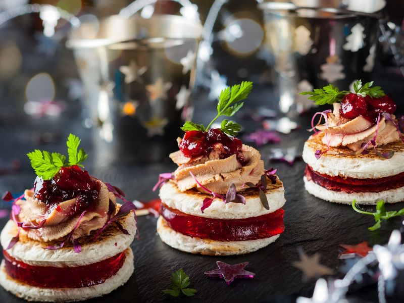 holiday inspired desserts - red white and topped with berries and little green leaves